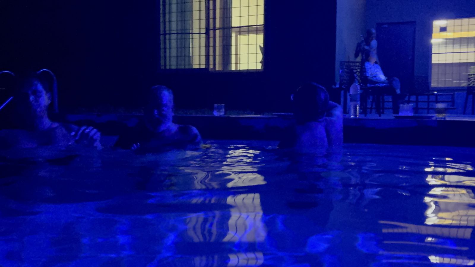 Group enjoying the night pool